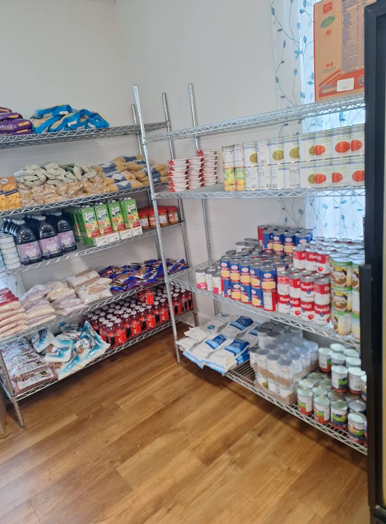 Pantry shelves stocked with various food items.