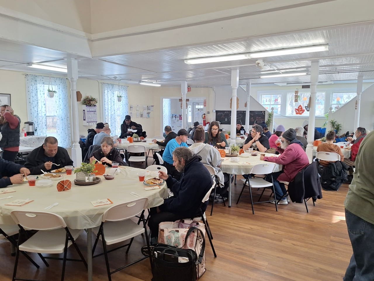People sharing a meal at a community center