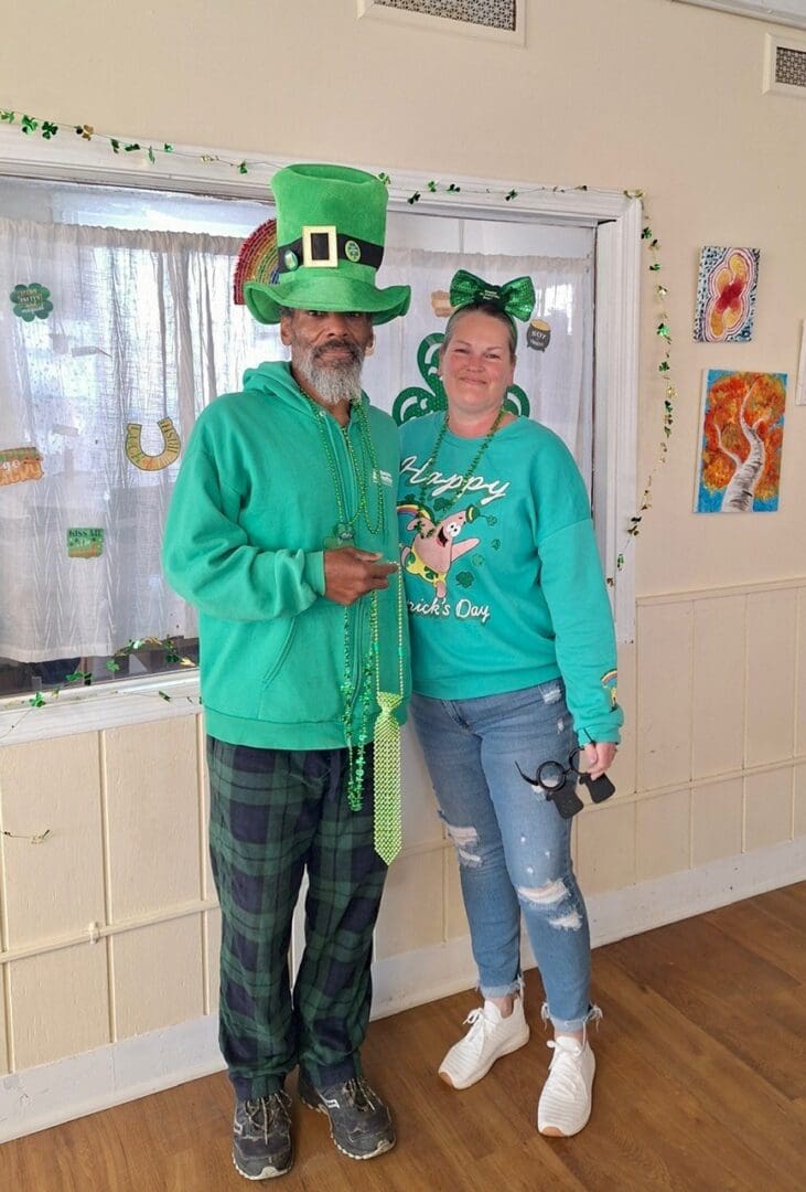 Two people in green St. Patrick's outfits